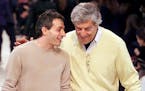 American-Greek designer Peter Speliopoulos, left, and Nino Cerruti talked on the catwalk after their fall-winter ready-to-wear fashion show presentati