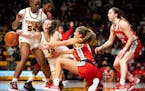 Gophers forward Kayla Mershon fights Ohio State guard Jacy Sheldon for a loose ball in the second quarter Saturday
