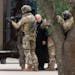 Authorities escorted a hostage out of the Congregation Beth Israel synagogue in Colleyville, Texas, Saturday, Jan. 15, 2022. Police said the man was n