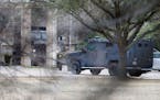 Armored vehicles are seen outside Congregation Beth Israel in Colleyville, Texas, on Saturday, Jan. 15, 2022. 