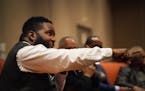 Umar Johnson, president of the Frederick Douglass Marcus Garvey Academy, spoke during a community discussion at the MLK Now 2022 event in Minneapolis 