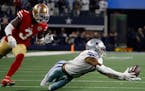 Cowboys wide receiver Cedrick Wilson couldn’t come up with a fourth-down pass in front of 49ers safety Jaquiski Tartt during the fourth quarter of S
