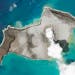 In this satellite photo taken by Planet Labs PBC, an island created by the underwater Hunga Tonga Hunga Ha’apai volcano is seen smoking Jan. 7, 2022