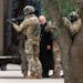 Shortly after 5 p.m., local time, authorities escort a hostage out of the Congregation Beth Israel synagogue in Colleyville, Texas, Saturday, Jan. 15,