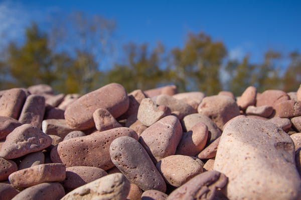 The pink rocks of Iona’s Beach near Two Harbors, Minn., were chipped off nearby rhyolite cliffs.  