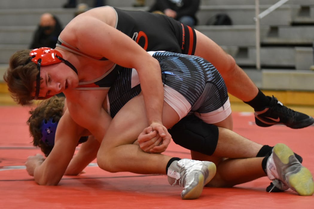Stillwater’s Ryder Rogotzke, top, is ranked third in the country at 182 pounds.
