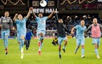 Minnesota United players, shown here celebrating after a win last season, will return to training on Tuesday.