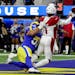 Kyler Murray (1) of the Arizona Cardinals is tackled by by Anthony Hines III (57) of the Los Angeles Rams in the second quarter.