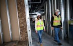 Opus Regional Vice President Beth Duyvejonck, left, and site superintendent Craig Anderson perform a site safety audit in a new activity center being 