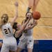 Maddyn Greenway (30) of Providence Academy drives on two defenders during the girls’ 2A basketball tournament in March.