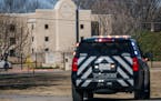 A law enforcement vehicle sits near the Congregation Beth Israel synagogue in Colleyville, Texas, the day after a man held hostages there for more tha