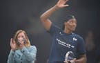 Lynx center Sylvia Fowles waved after WNBA Commissioner Cathy Engelbert presented her the WNBA Defensive Player of the Year on Sept. 26.