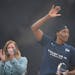 Lynx center Sylvia Fowles waved after WNBA Commissioner Cathy Engelbert presented her the WNBA Defensive Player of the Year on Sept. 26.