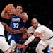 Timberwolves center Karl-Anthony Towns drove to the basket against Knicks guard Immanuel Quickley (5) and center Taj Gibson.