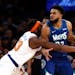 Knicks center Mitchell Robinson defends  Timberwolves center Karl-Anthony Towns during Tuesday’s game. 