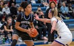 Hopkins’ Maya Nnaji, the No. 9 recruit in the Class of 2022, looked for a way past Chaska’s Mallory Heyer, a future Gopher.