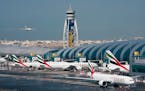Airlines across the world, including the long-haul carrier Emirates, rushed Wednesday to cancel or change flights heading into the U.S. over an ongoin