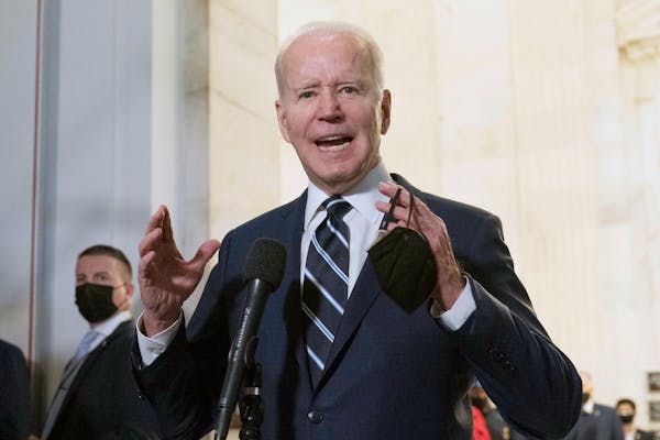President Joe Biden speaks to the media after meeting privately with Senate Democrats Thursday on Capitol Hill in Washington.