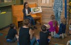 Storyteller Abby Johnson reads to children during Ojibwe Storytime at the Duluth Depot. The weekly event not only introduces children to Ojibwe tradit