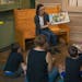Storyteller Abby Johnson reads to children during Ojibwe Story Time at the Duluth Depot. The weekly event not only introduces children to Ojibwe tradi