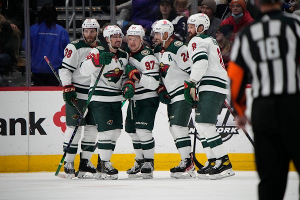 Wild players celebrated a goal by Kirill Kaprizov (97) during Monday’s loss in Colorado.i)