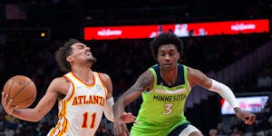 Timberwolves forward Jaden McDaniels fouled Hawks guard Trae Young during the first half. Young led Atlanta with a game-high 37 points.