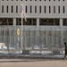 A pedestrian made his way in front of a gated Warren E. Burger Federal Building as jury selection begins in the trial of ex-Minneapolis officers charg