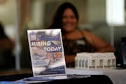 Minnesota’s unemployment rate ticked lower even after the state lost jobs in December.