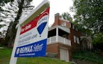 A for sale sign is displayed outside a home in Mount Lebanon, Pa., on Tuesday, Sept. 21, 2021. Average long-term U.S. mortgage rates continued to rise