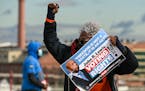 A demonstrator takes part in a march on Jan. 17 that urged lawmakers to take action on voting rights. Voting legislation was blocked in the U.S. Senat