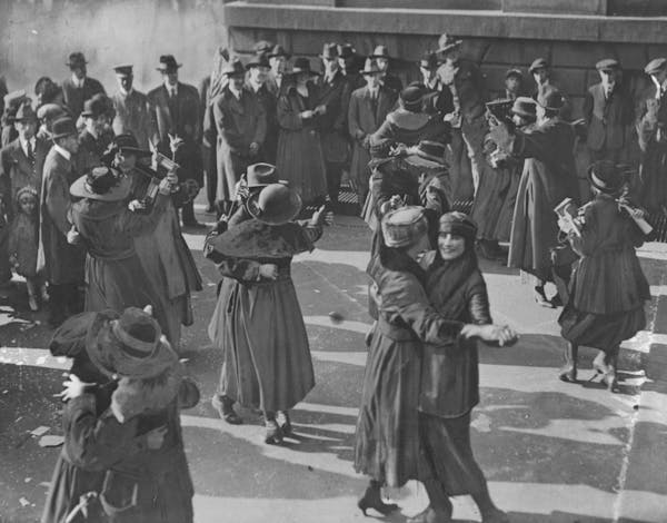 People danced in the streets of New York (above) and other cities, blew horns and shouted “The war is over” by way of celebrating the armistice en