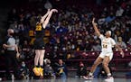 There was a lot of this Thursday: Iowa guard Caitlin Clark scored a three-point basket over Gophers forward Alanna Micheaux