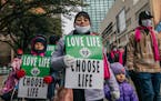 Pro-life demonstrators march during the “Right To Life” rally on Jan. 15, 2022, in Dallas, Texas.