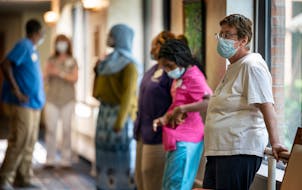 Nursing home workers waited to get tested for COVID-19 last August at Jones-Harrison Senior Living in Minneapolis.