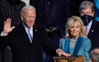 President Joe Biden takes the oath of office from Supreme Court Chief Justice John Roberts as his wife, Jill Biden, stands next to him during the 59th