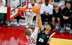 Michigan State’s Malik Hall blocks a shot by Wisconsin’s Steven Crowl during the first half Friday.