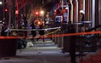 New York Police officers investigated the scene of a shooting in Harlem on Friday, Jan. 21, 2022.