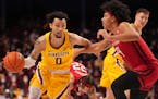 Minnesota guard Payton Willis (0) took the ball past Rutgers forward Ron Harper Jr. (24) in the first half.