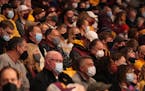 Masked Minnesota fans watched the Gophers-Rutgers game at Williams Arena recently.