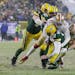San Francisco’s Arik Armstead sacks Green Bay’s Aaron Rodgers during the second half of Saturday’s NFC divisional playoff in Green Bay
