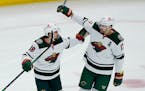 Marcus Foligno, right, celebrated with Mats Zuccarello after scoring a first-period goal for the Wild at Chicago on Friday. The Wild’s top scorers r