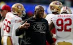 FILE - San Francisco 49ers defensive coordinator DeMeco Ryans greets a player before the team’s NFL football game against the Los Angeles Rams on Ja
