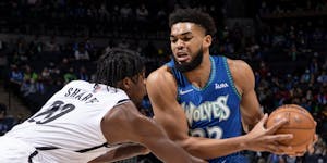 Center Karl-Anthony Towns drove on the Nets’ Day’Ron Sharpe in the first quarter of the Wolves’ 136-125 victory at Target Center on Sunday.