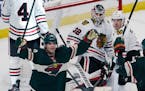 Minnesota Wild's Kevin Fiala, left, celebrates his goal against Chicago Blackhawks goalie Kevin Lankinen (32) during the third period of an NHL hockey