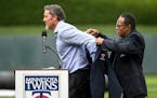 Rod Carew helped put a Twins Hall of Fame jacket on Joe Nathan on Aug. 3, 2019 at Target Field. Nathan is in his first year on the ballot for the Base