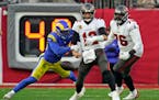 Los Angeles Rams outside linebacker Von Miller (40) strips the ball from Tampa Bay Buccaneers quarterback Tom Brady (12) during the second half of an 