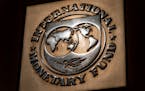 FILE - The logo of the International Monetary Fund is visible on their building, Monday, April 5, 2021, in Washington. The International Monetary Fund