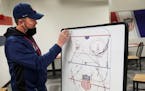 Women’s Olympic team hockey coach Joel Johnson maps out strategy in his office at the National Sports Center in Blaine. He’s also the women’s co