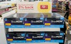 Boxes of BinaxNow home COVID-19 tests made by Abbott are shown for sale on Nov. 15, 2021, at a CVS store in Lakewood, Wash. 