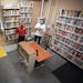 St. Paul College’s culinary library has outgrown its space. Librarian Ben Tri, left, and Nathan Sartain, chef and culinary instructor, show us some 